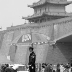 Chinese Policeman under a McDonald's umbrella directing traffic in China