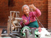 Woman spinning yarn in Nepal