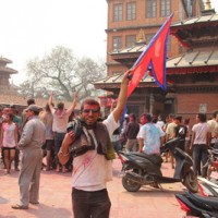 Man waving Nepalese flag