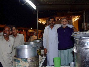 Dinner vendors over the Hudus River, Pakistan