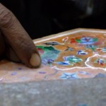 Jewellers in Agra, India - Delicate slivers of gems being paced into marble in Agra