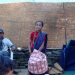 Girl singing at rural Nepalese wedding