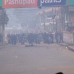 The riot police charge forward in Kathmandu