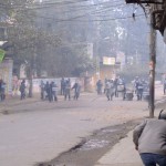 Running from the riot police charge (click to enlarge)