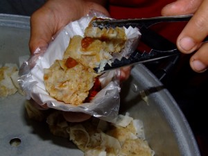Siomai with chili sauce on top, usually served in 3's or 6's