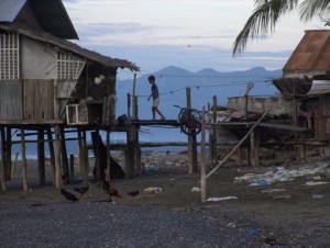 Stilt house and boy at dawn in Brooke's Point, Palawan, The Philippines Stilt house and boy at dawn in Brooke's Point, Palawan, The Philippines (click to enlarge)