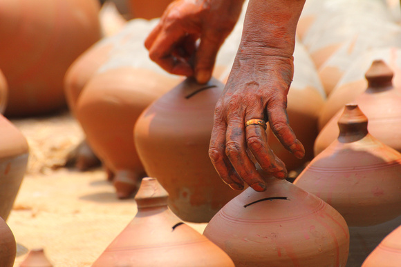 Drying pots and potters hand in Bhaktapur