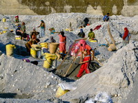 Families working in a river mine in Nepal