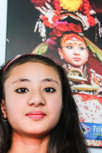 ari Samita Bajracharya,with a photograph of her when she was a goddess, Nepal