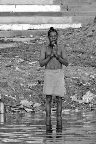 Man in Morning Prayers on the Ganges - India