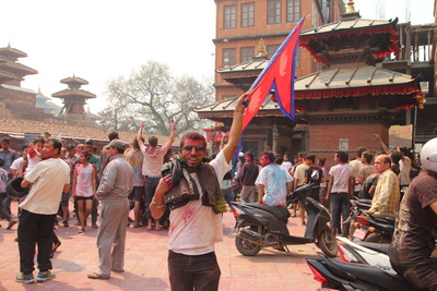 Man waving Nepalese flag