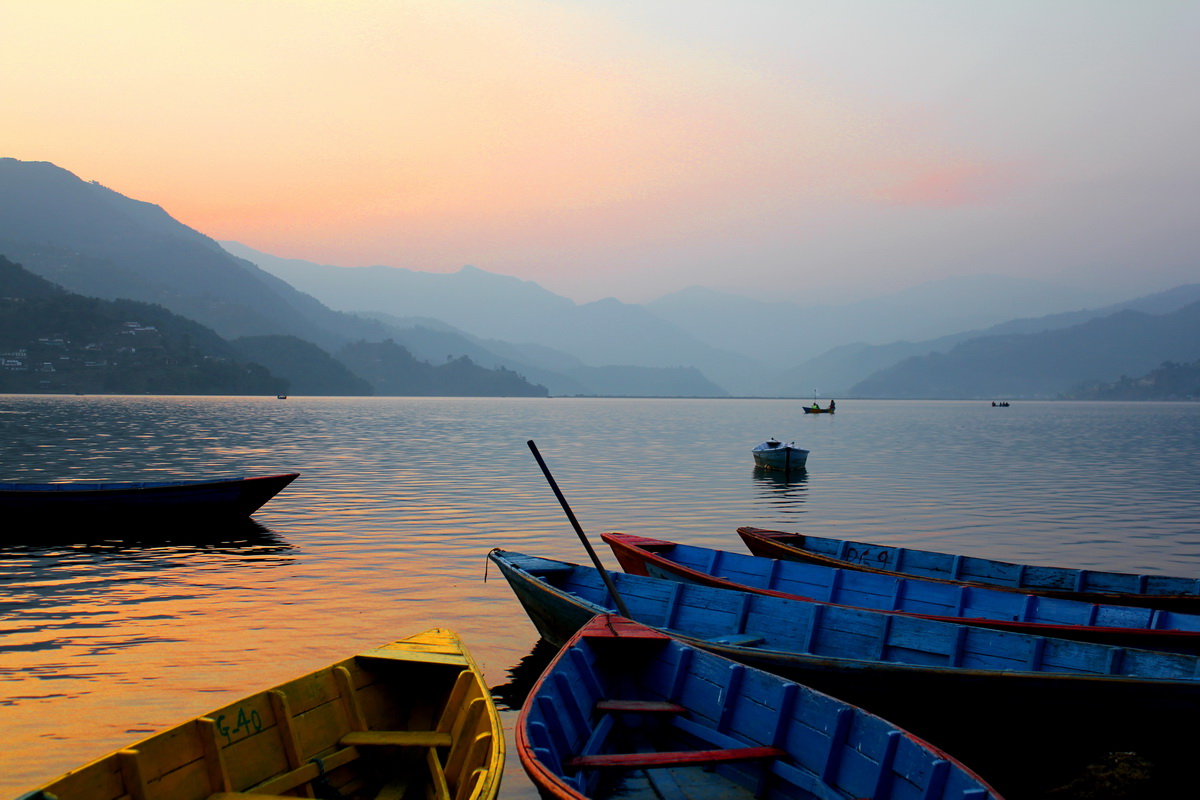 Boats by Phewa Lake in Pokhara , Nepal