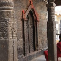 Woman sitting on Koti Mahadev Temple