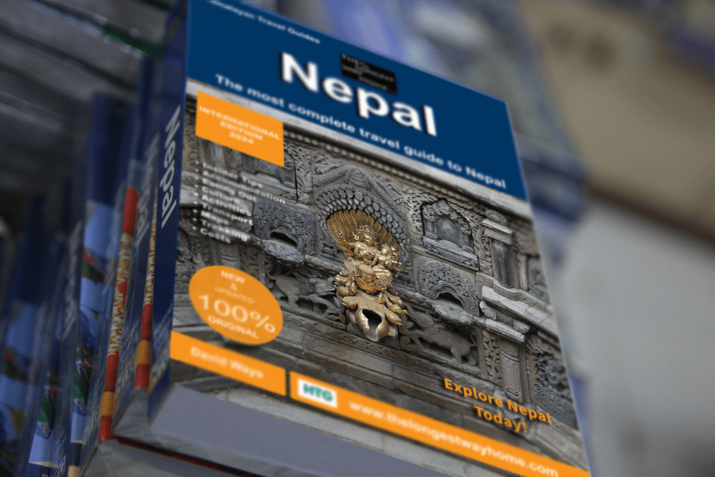 Nepal guidebook 2024 on top of other guidebooks